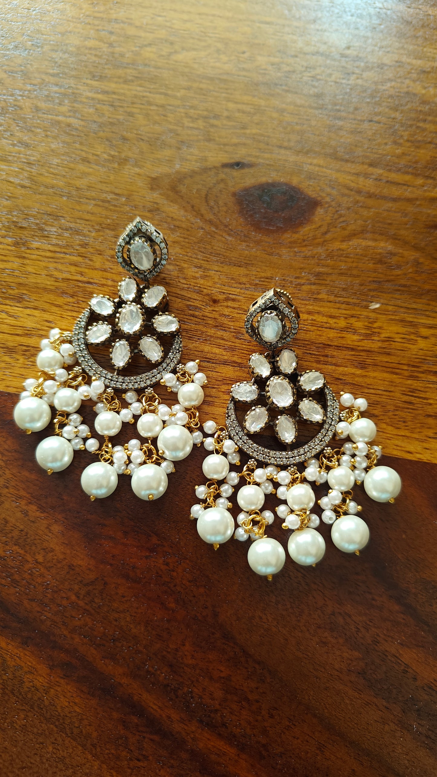 Kundan earrings with crescent moon and pearls