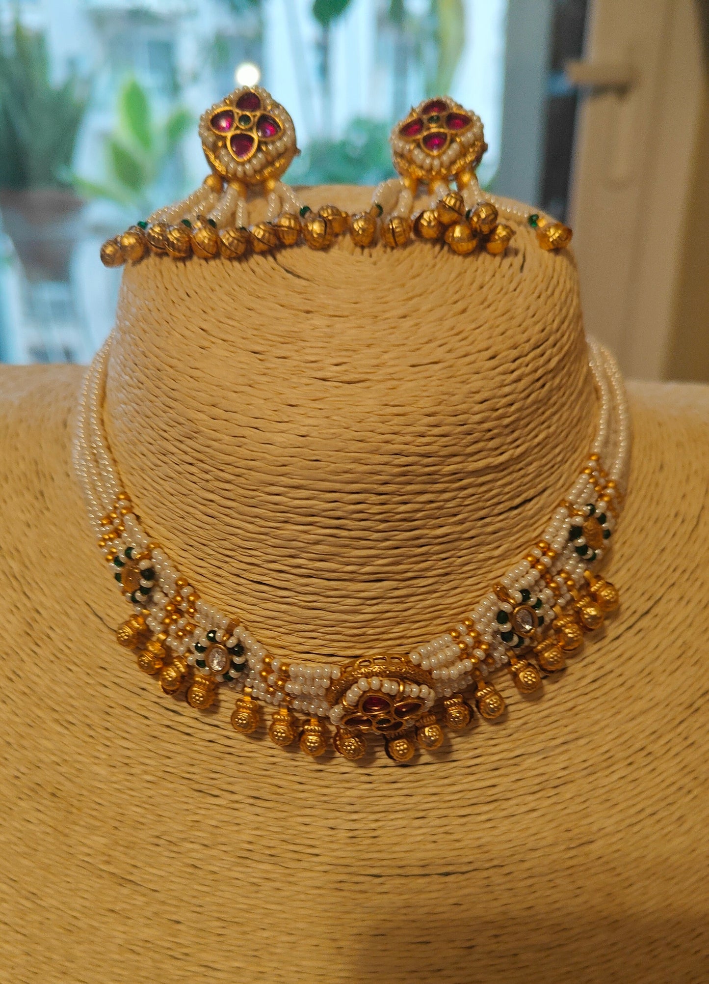 Ekta set with stone work on poth pearls