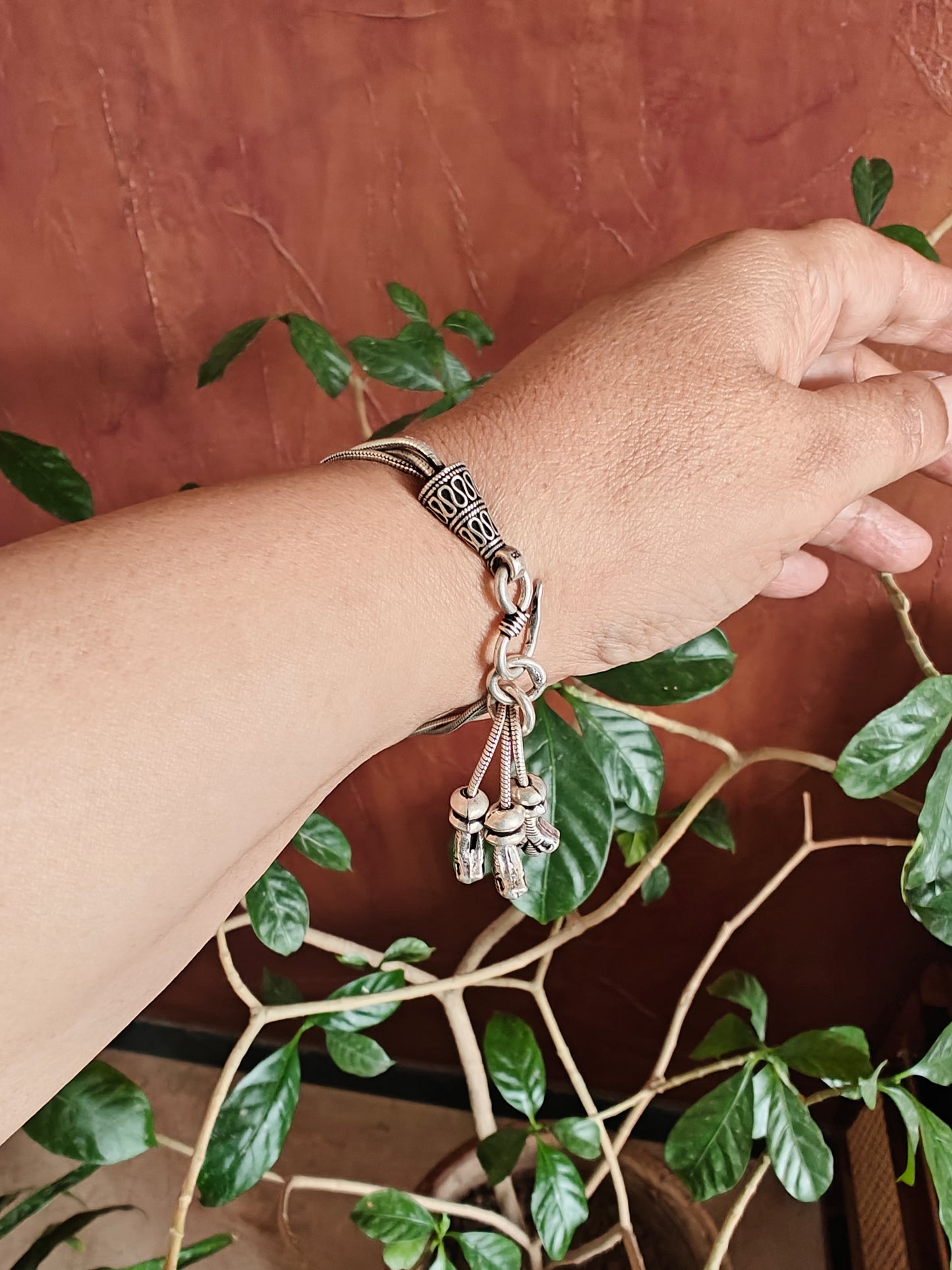 Trikaya silver bracelet with hangings