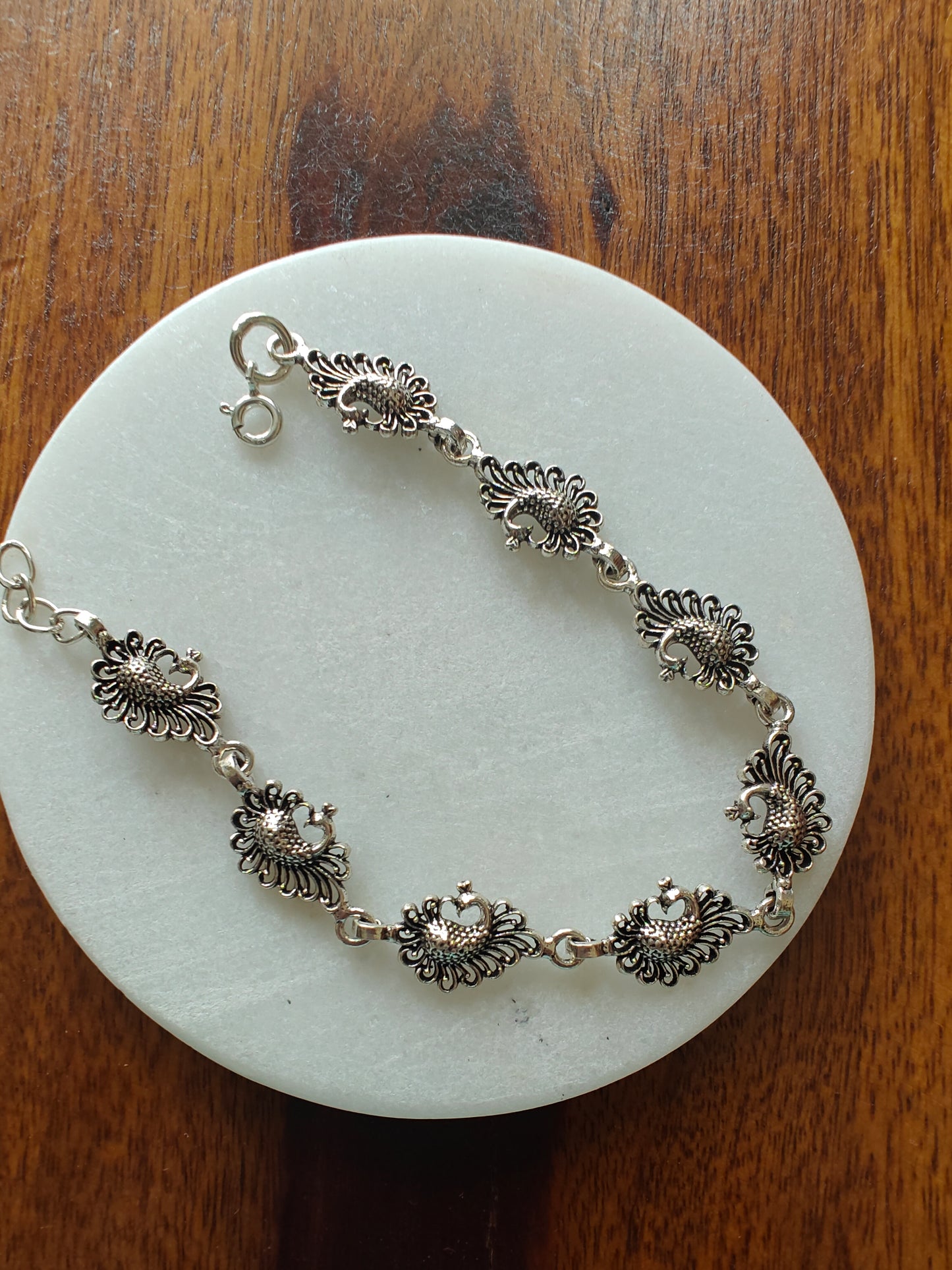 Vritti silver bracelet with peacocks