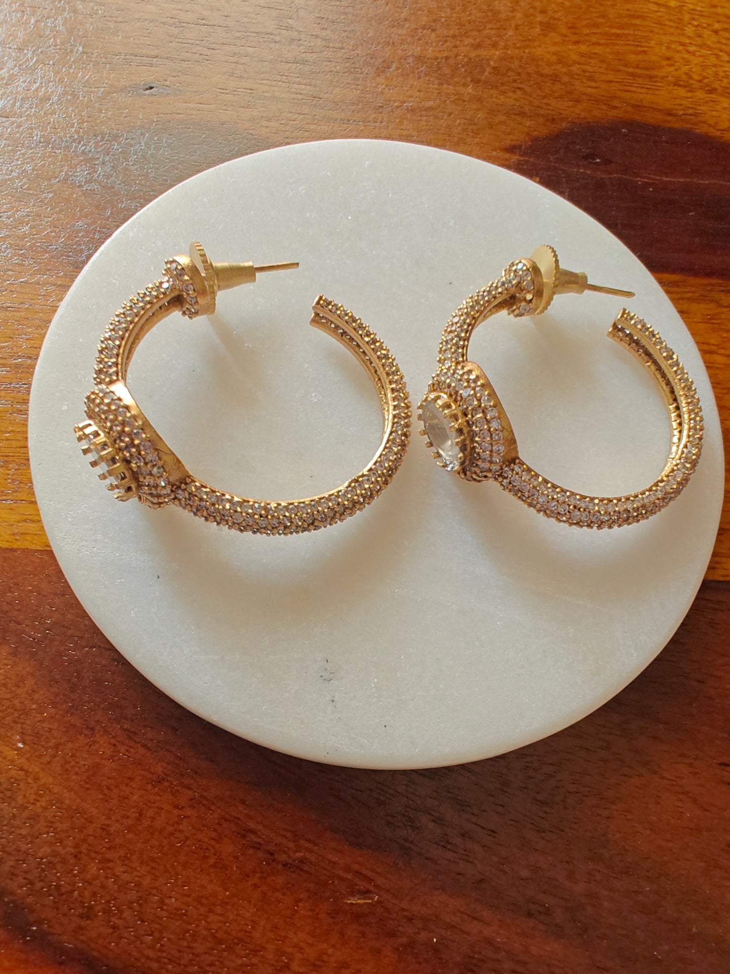 Bali(earrings)with a moissanite surrounded with CZ