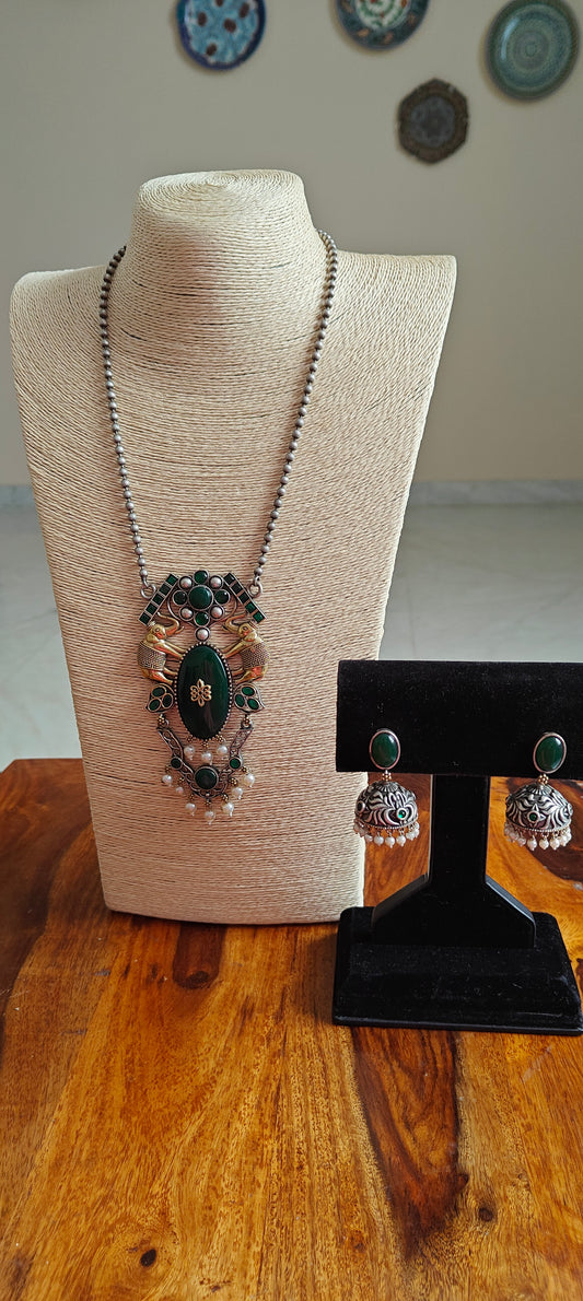 Dual tone set with big green stone pendant and elephants