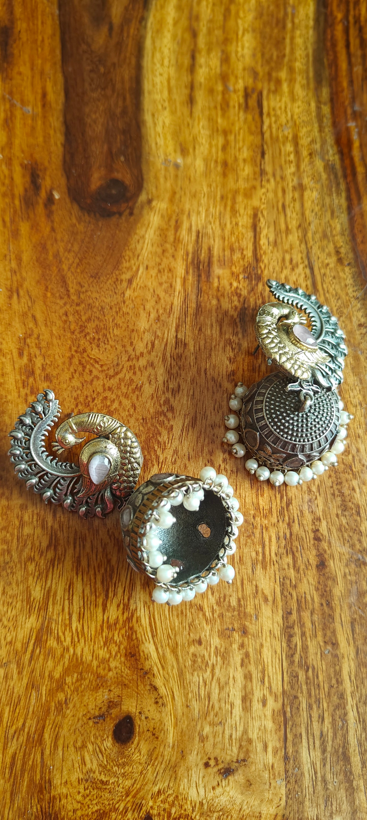 Dual tone peacock jhumkas with stone