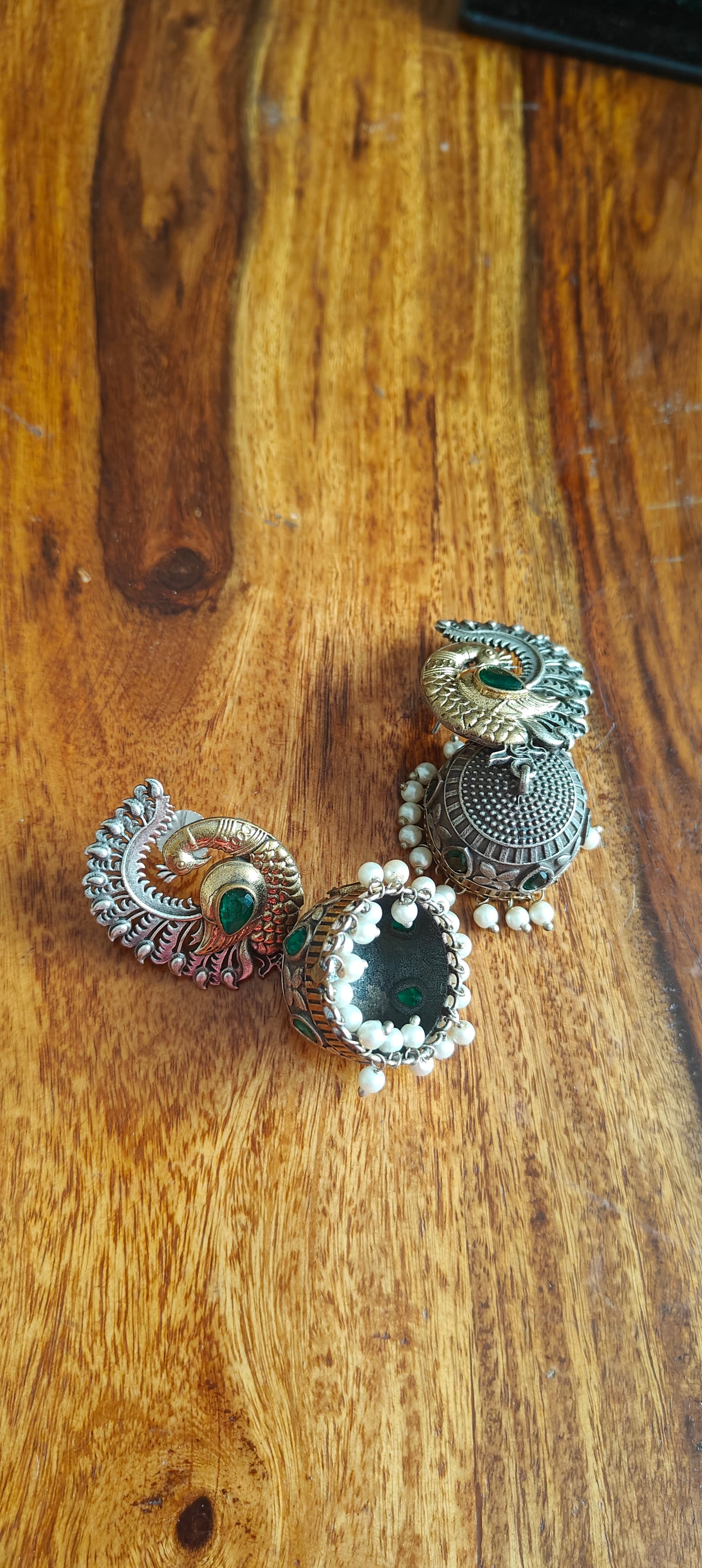 Dual tone peacock jhumkas with stone