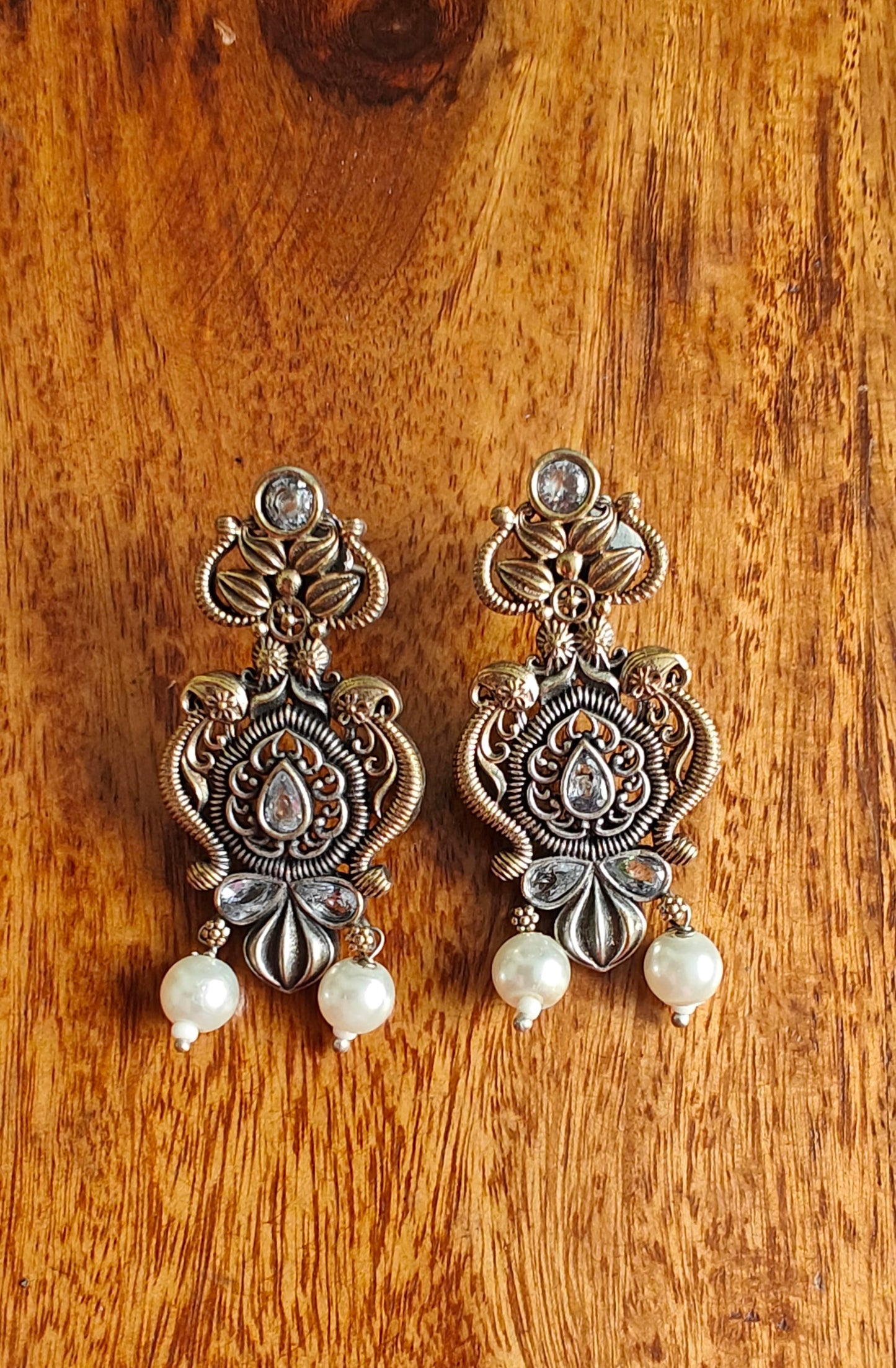 Dual tone intricate design earrings