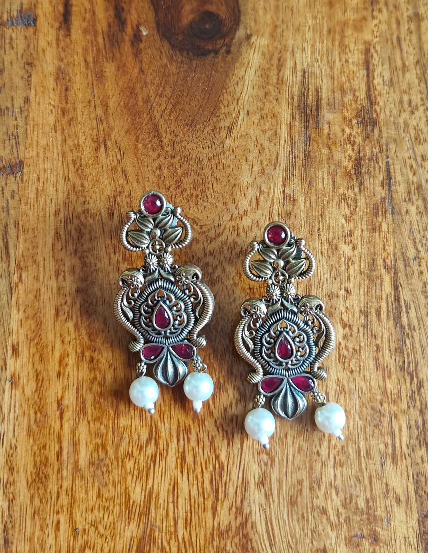 Dual tone intricate design earrings