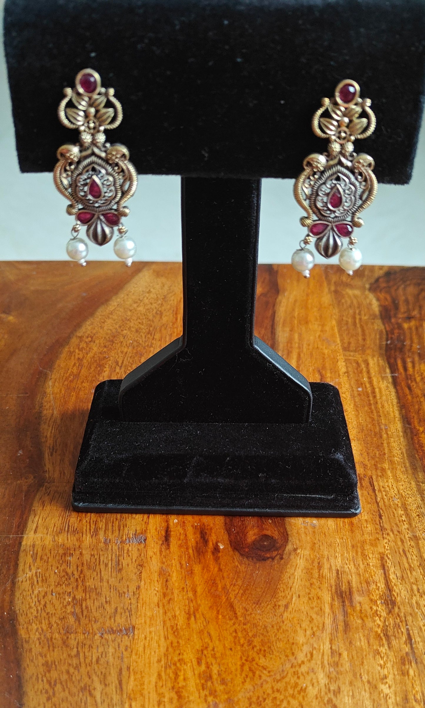 Dual tone intricate design earrings