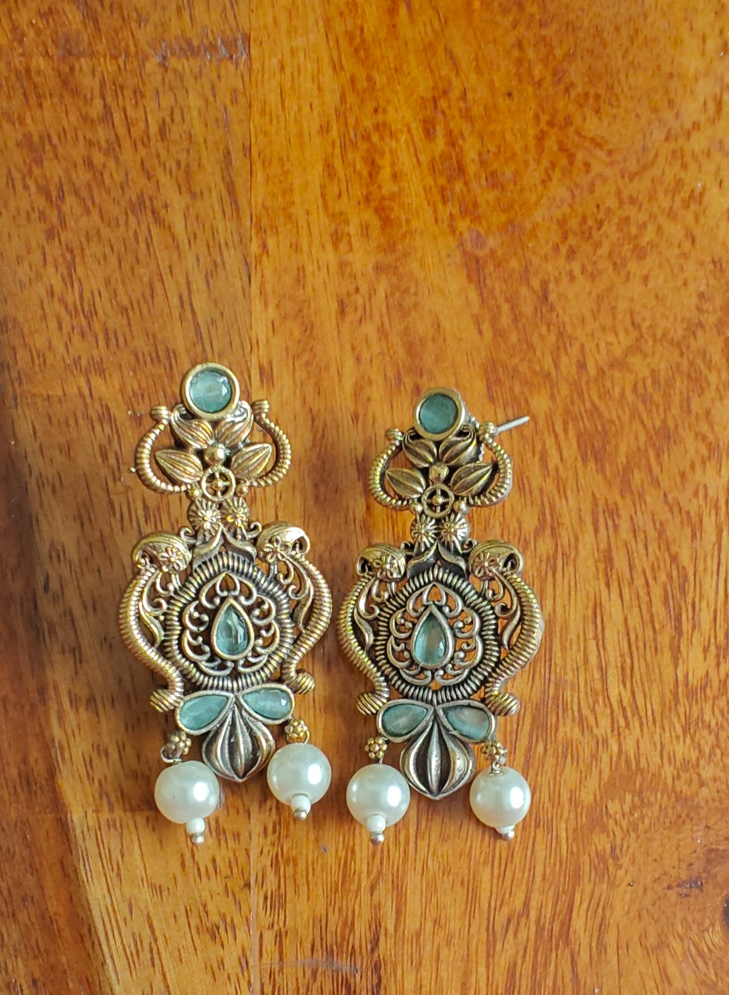 Dual tone intricate design earrings