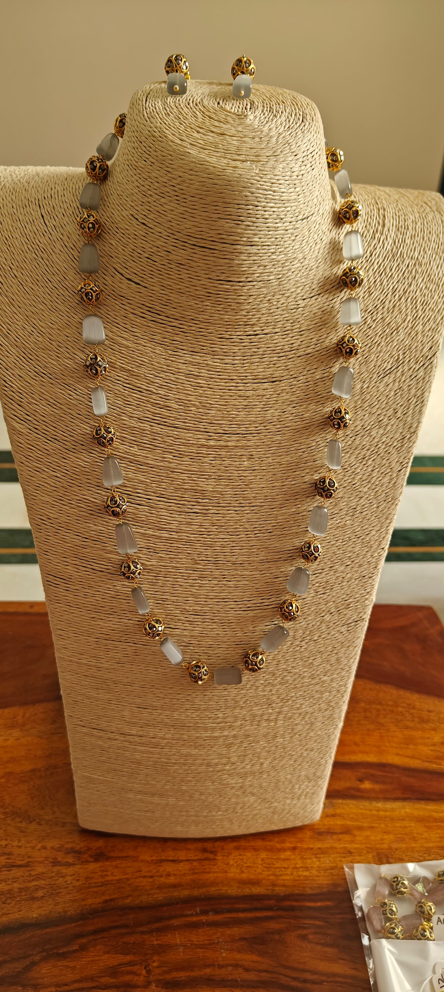 Bead set with rectangular stones and metal beads