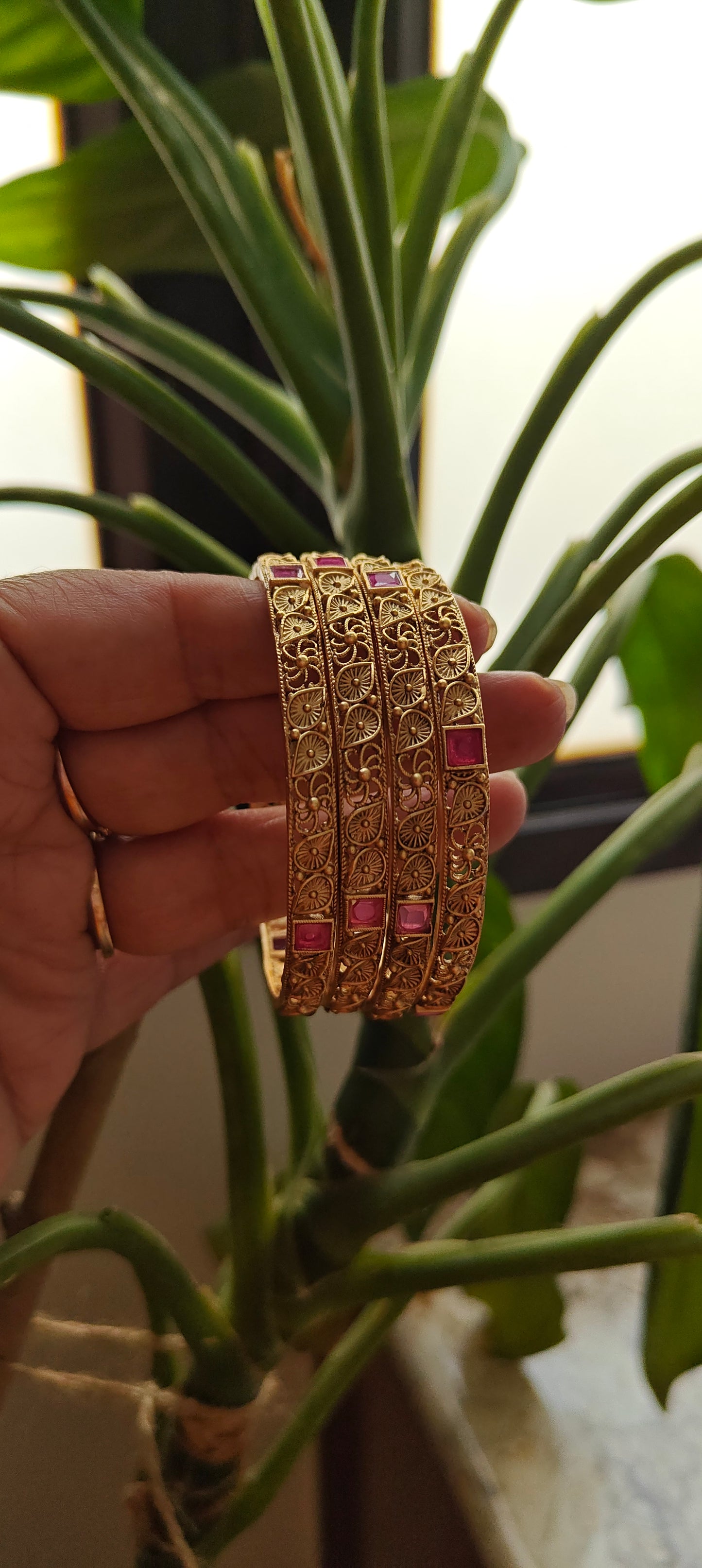 Carved bangles with ruby red stone highlights(4 pc)