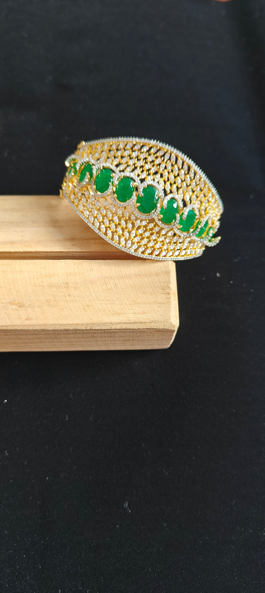 Emerald stone golden jali kara( bangle) with emerald colour stone