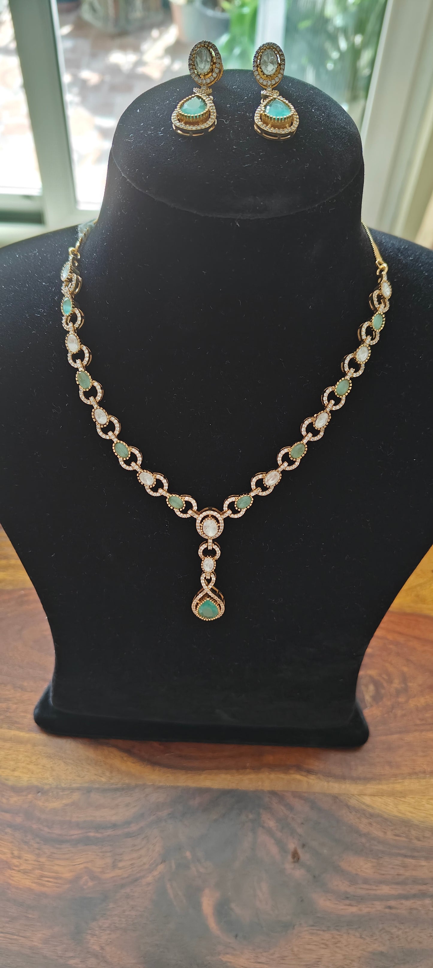 Amiya link chain set with kundan and mint green stones