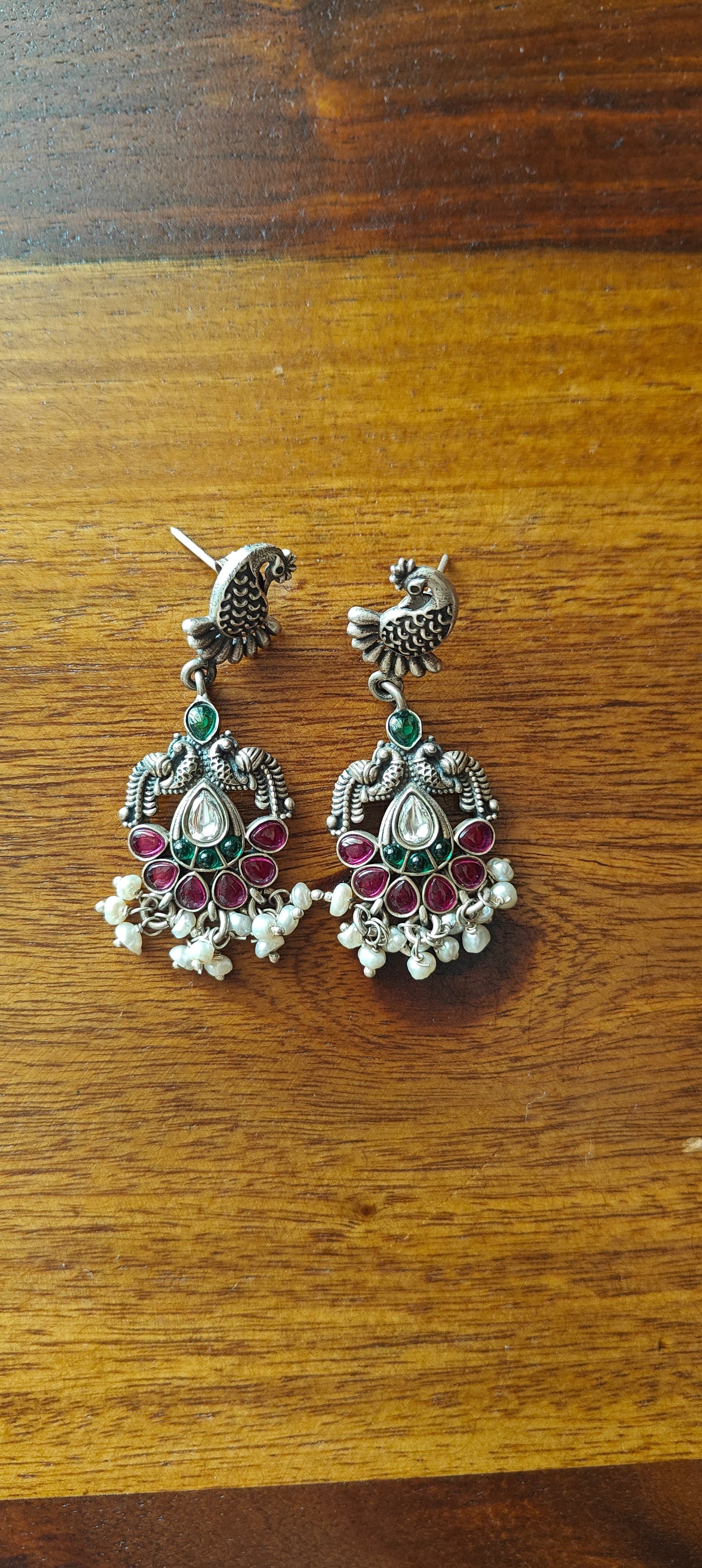 Hasika silver peacock earrings