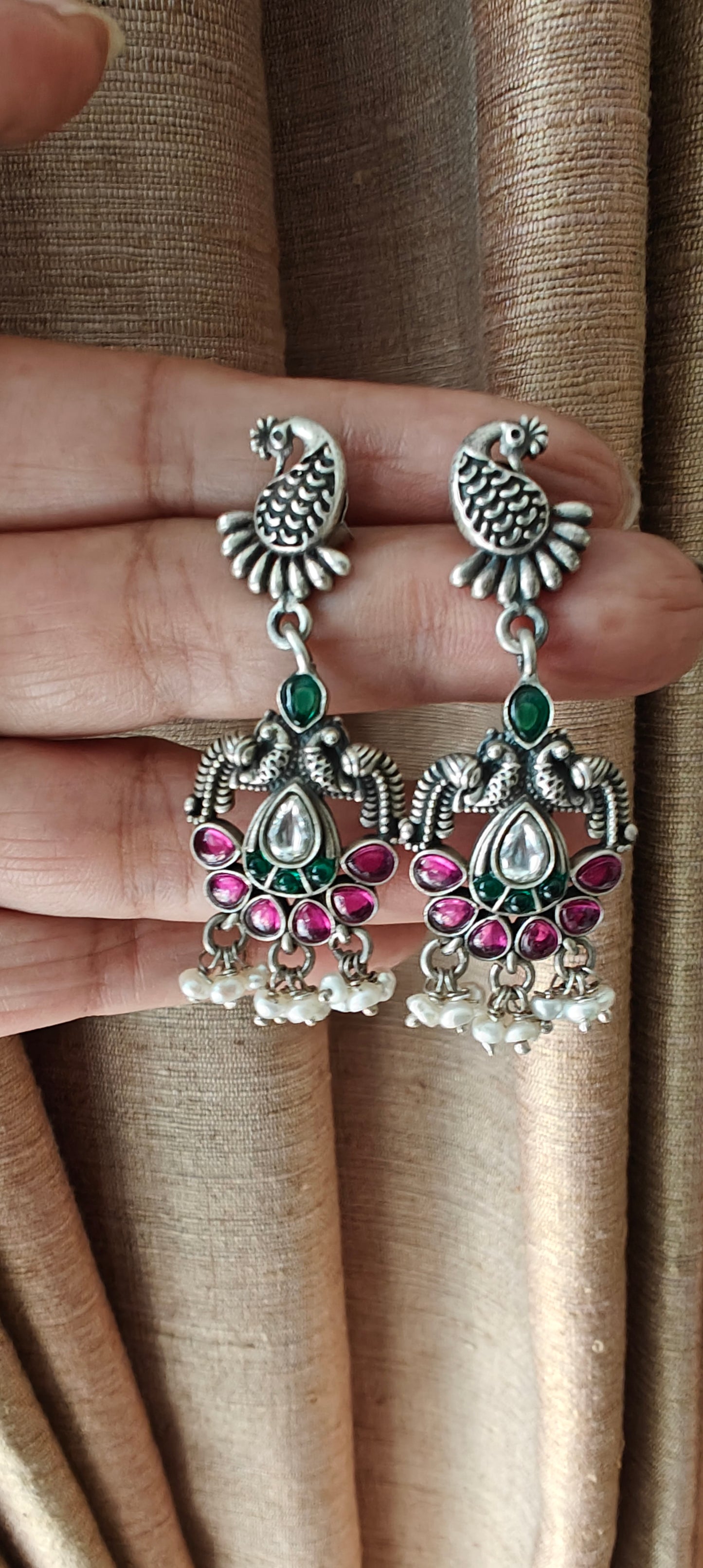 Hasika silver peacock earrings