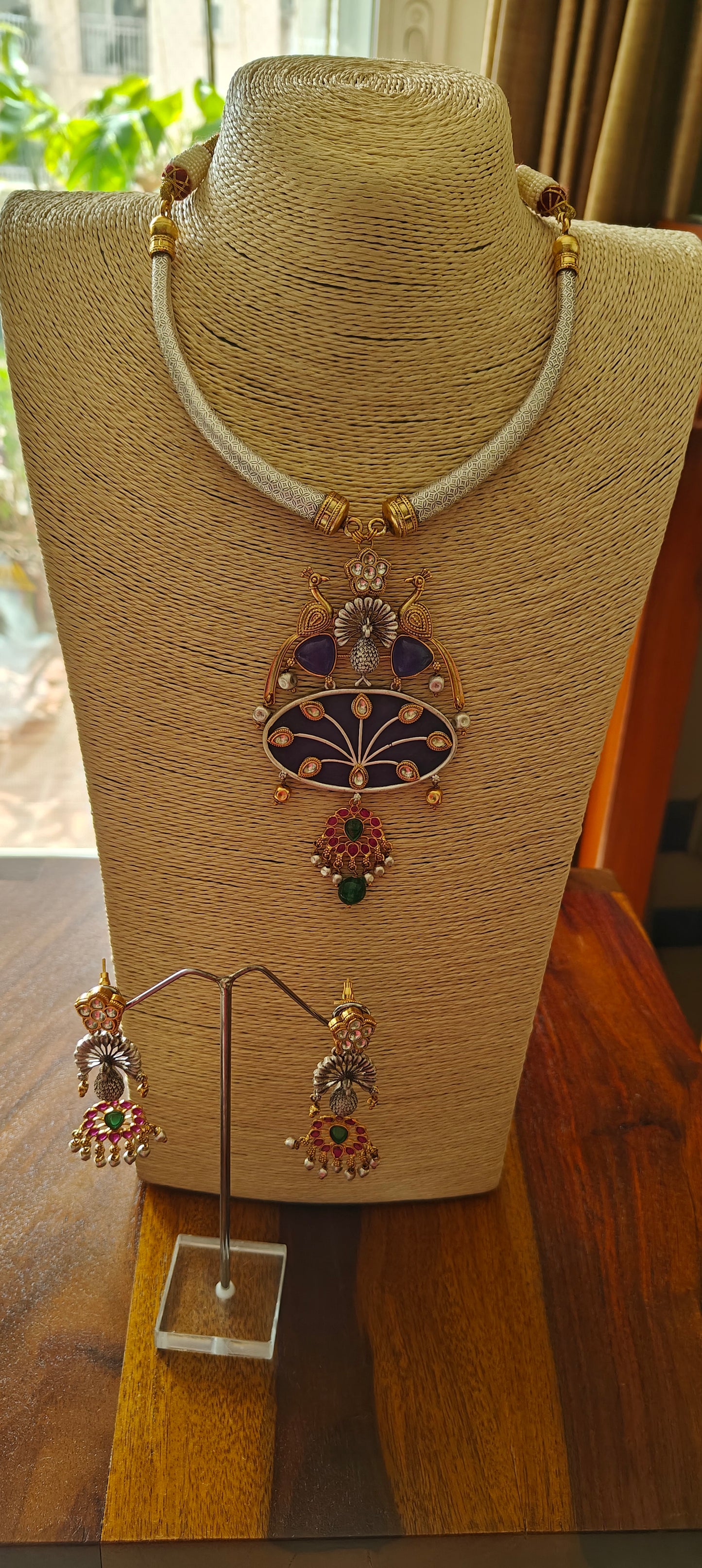 Hasli set in dual tone, pearched peacocks on stone pendant with Kundan work, matching earrings