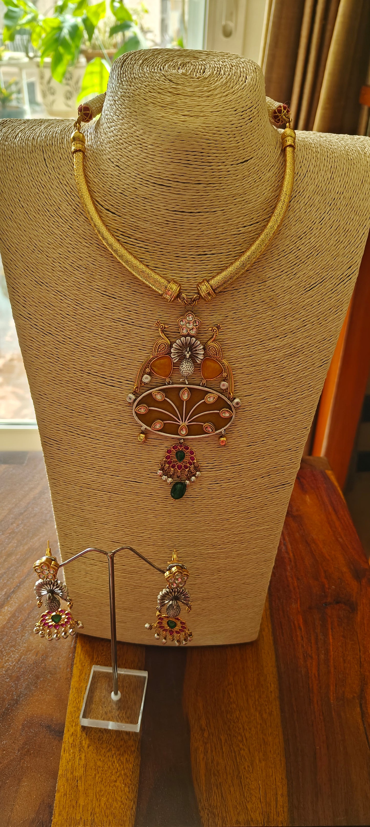 Hasli set in dual tone, pearched peacocks on stone pendant with Kundan work, matching earrings