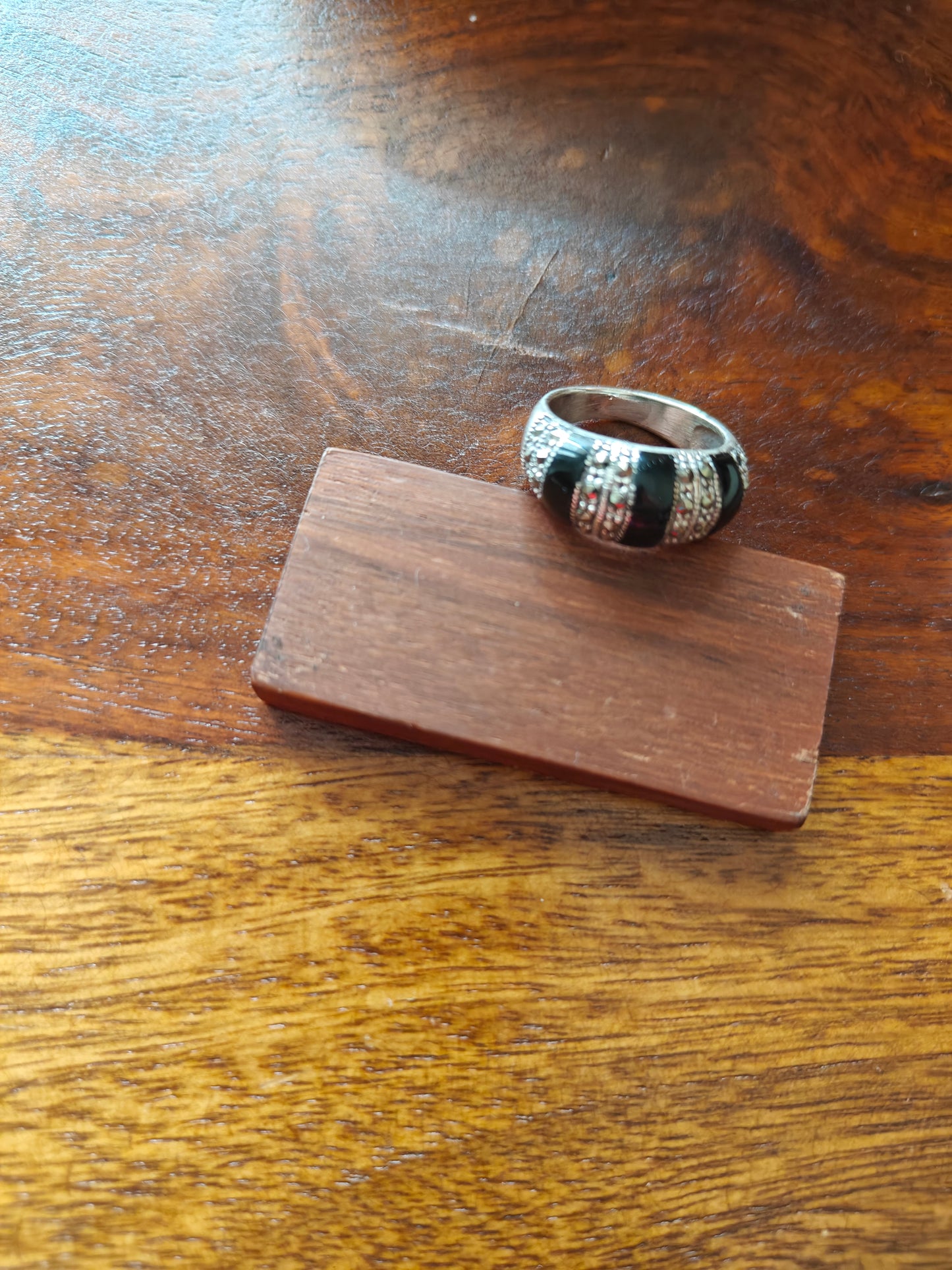 Silver ring with three black bands