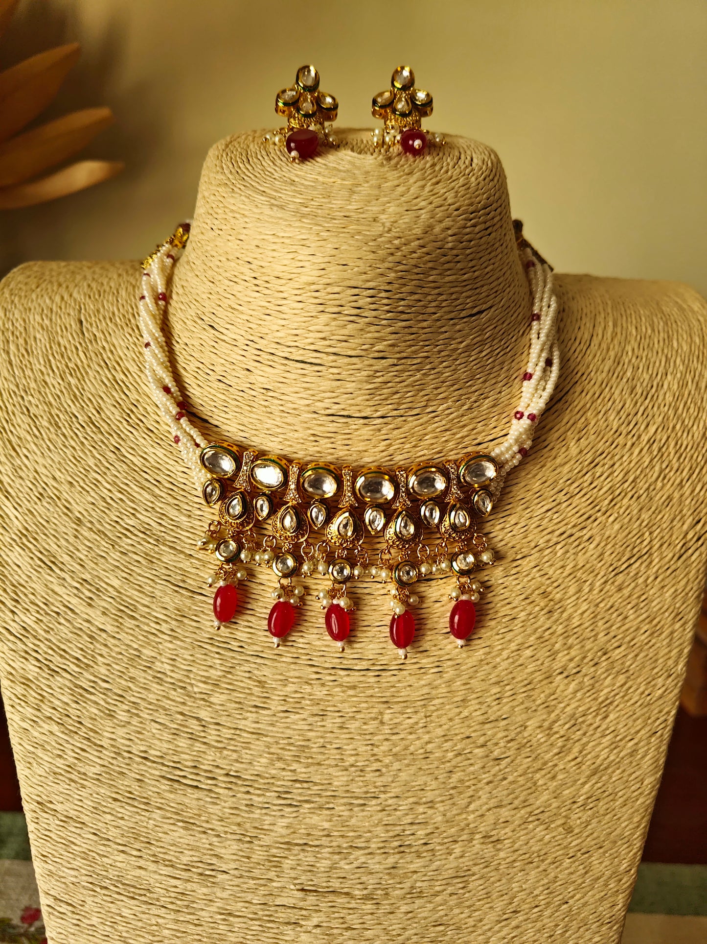 Devya set with engraved gold and kundan pieces on poth pearl strings
