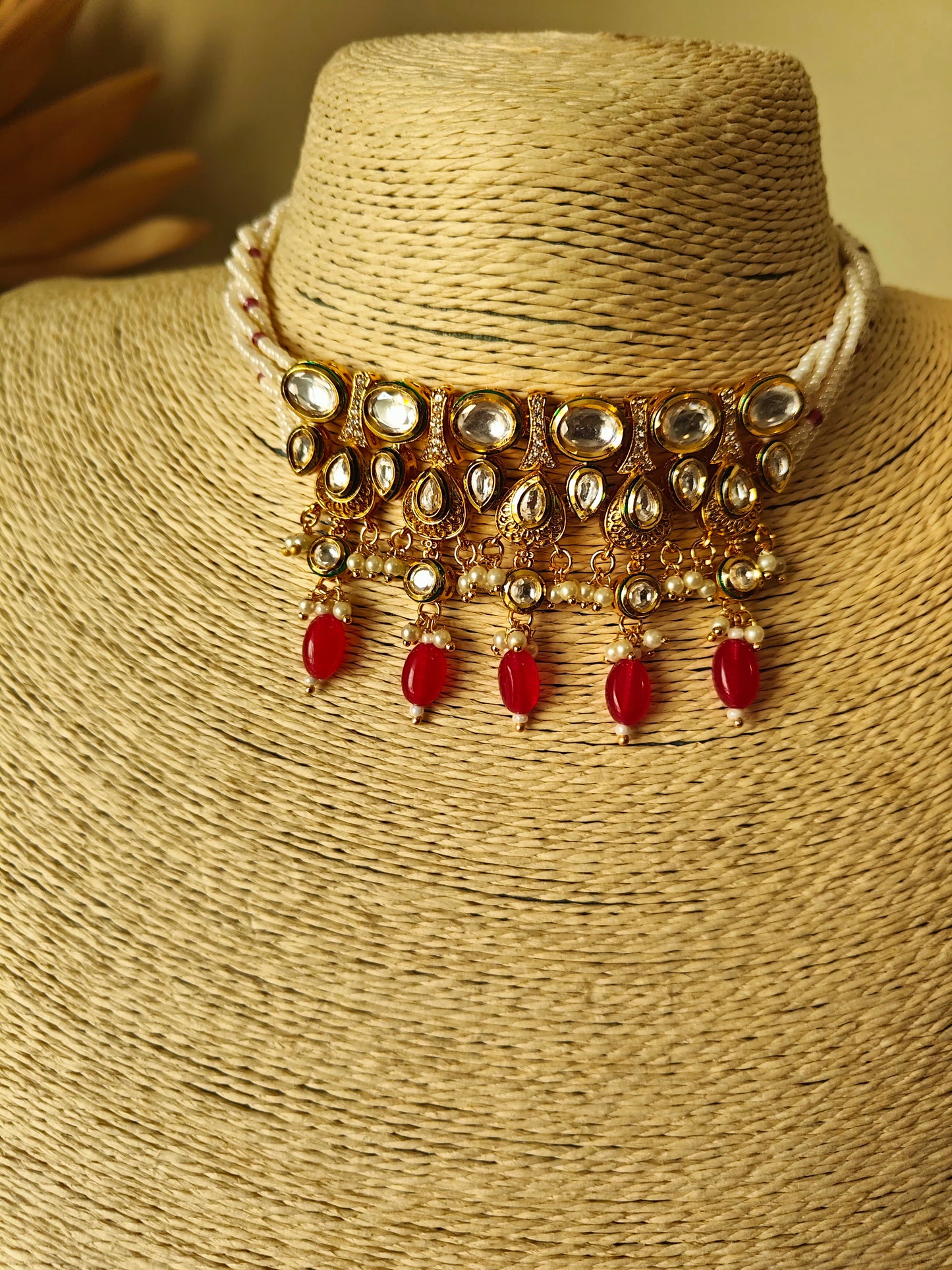 Devya set with engraved gold and kundan pieces on poth pearl strings