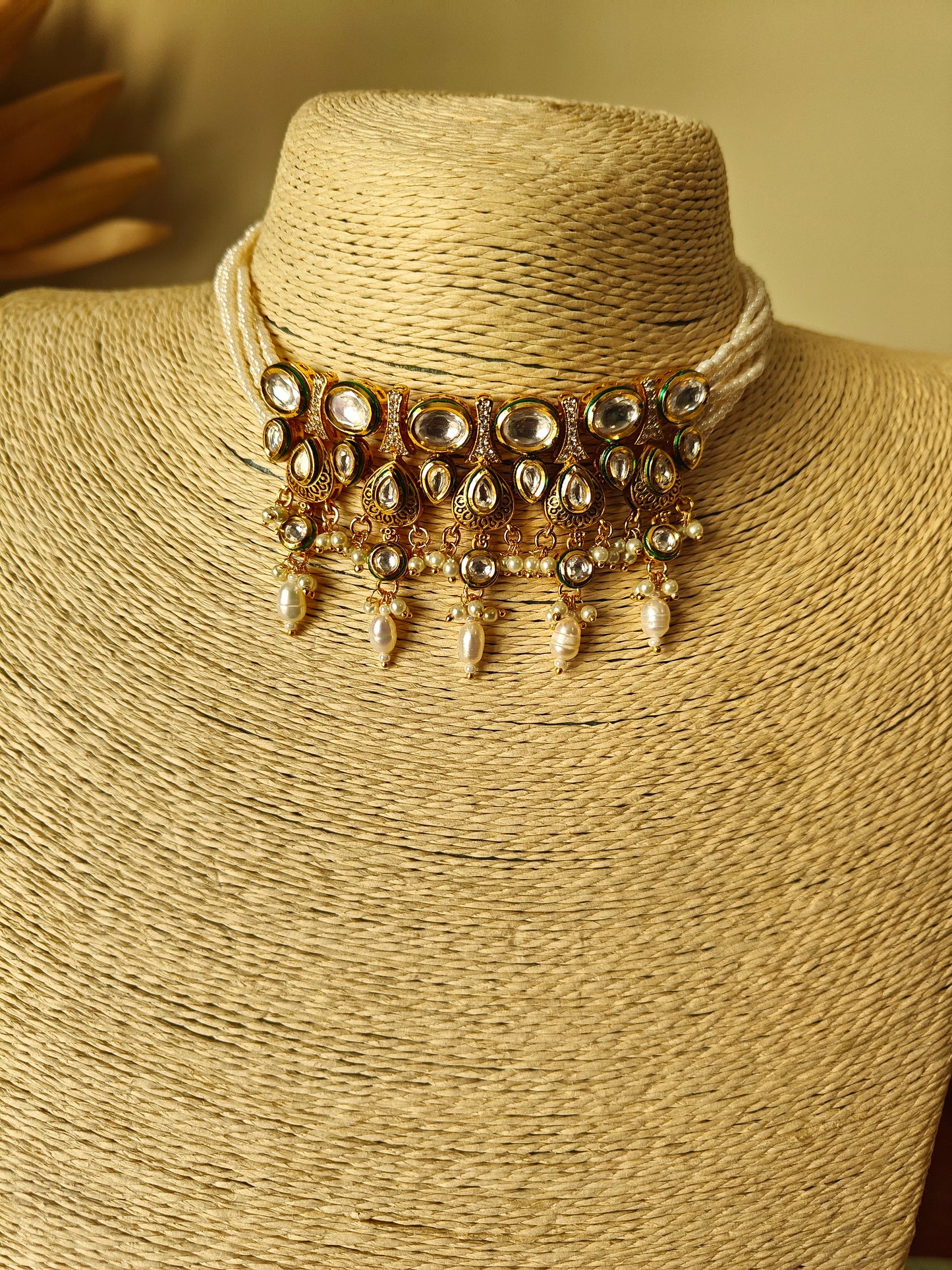 Devya set with engraved gold and kundan pieces on poth pearl strings
