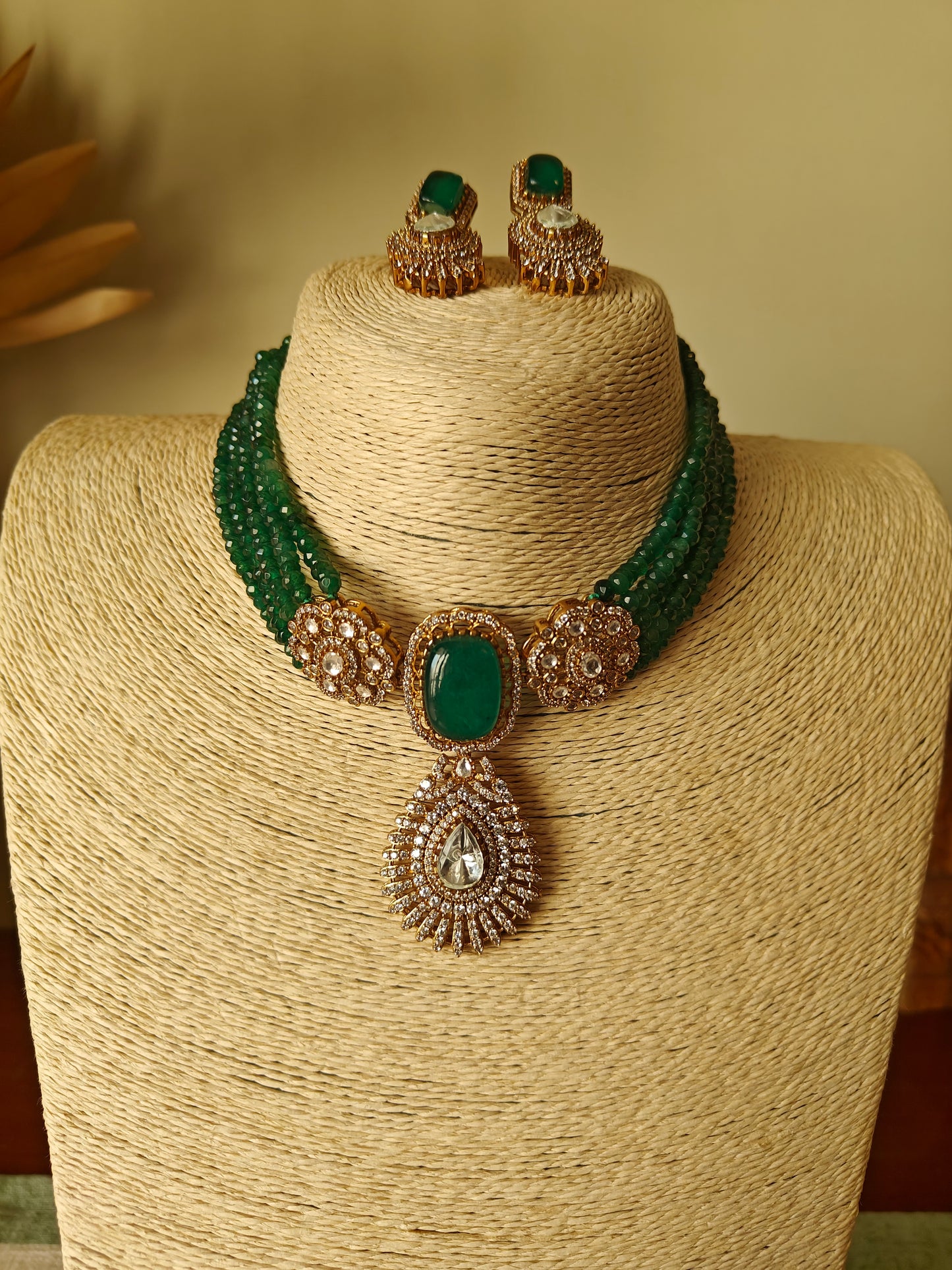 Padmal five strings choker set with central piece with stone and moissanite