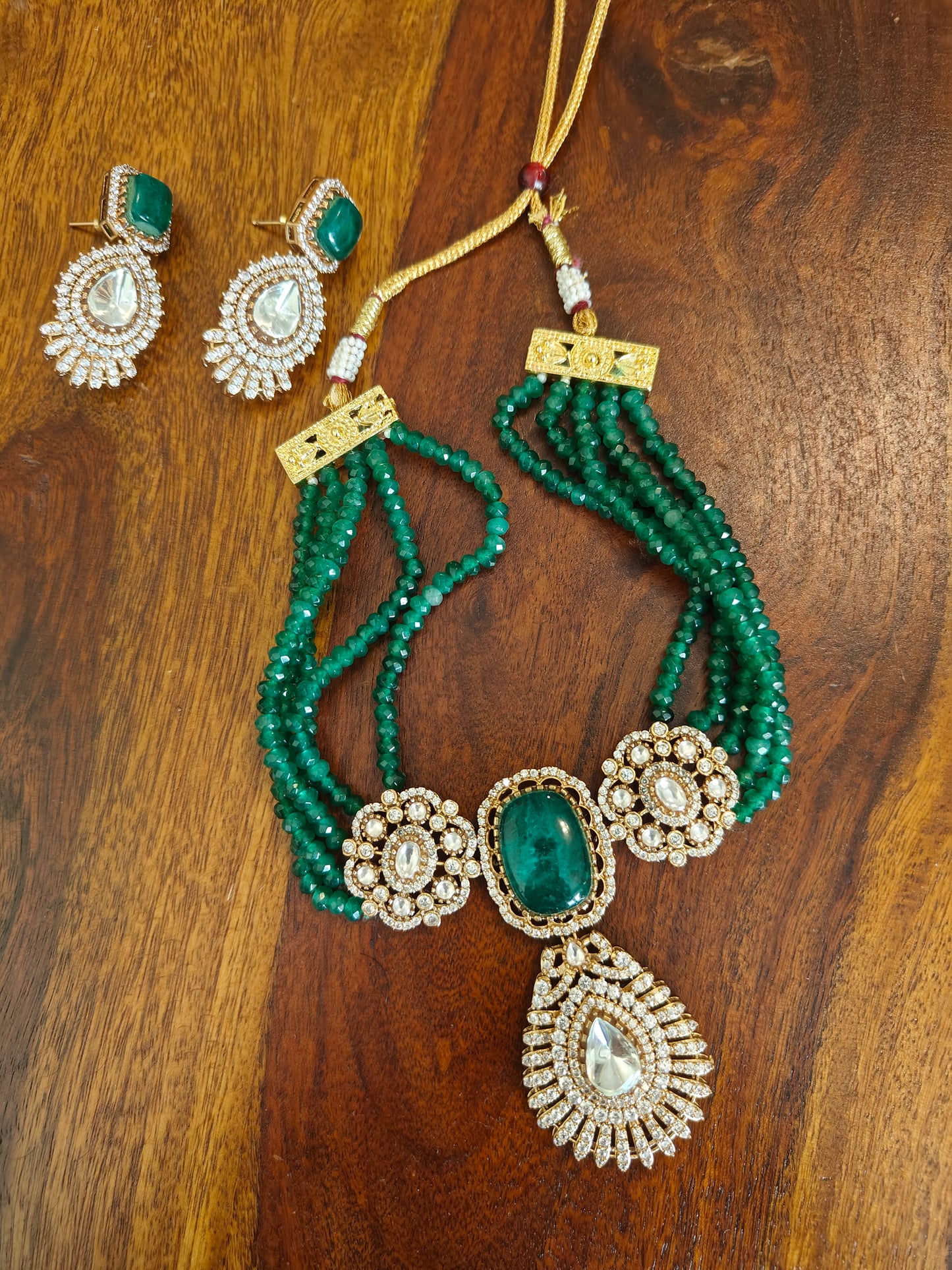 Padmal five strings choker set with central piece with stone and moissanite