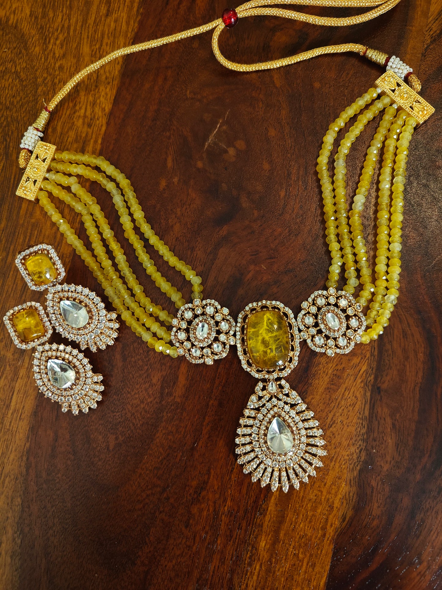 Padmal five strings choker set with central piece with stone and moissanite