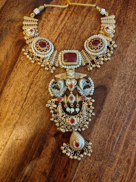 Nirmitha dual tone set with red stones