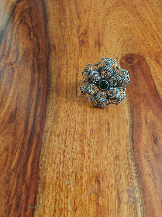Sterling silver flower ring with green emerald stone
