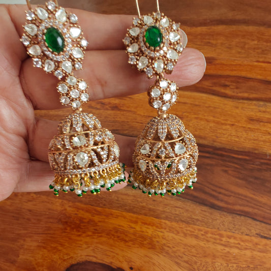 Long jhumkis with moissanite and emerald green stone