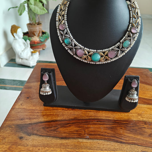 Dual tone set with stones and pearl edging