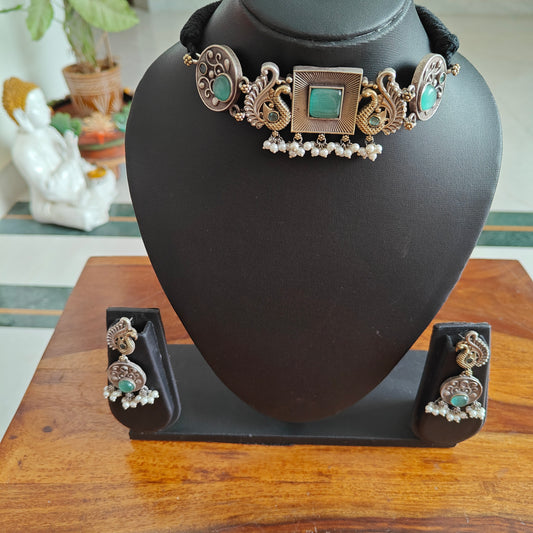 Dual tone choker set with square centre with stone and peacocks