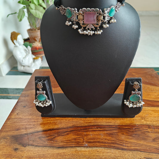Dual tone choker with pink square and green stones on side