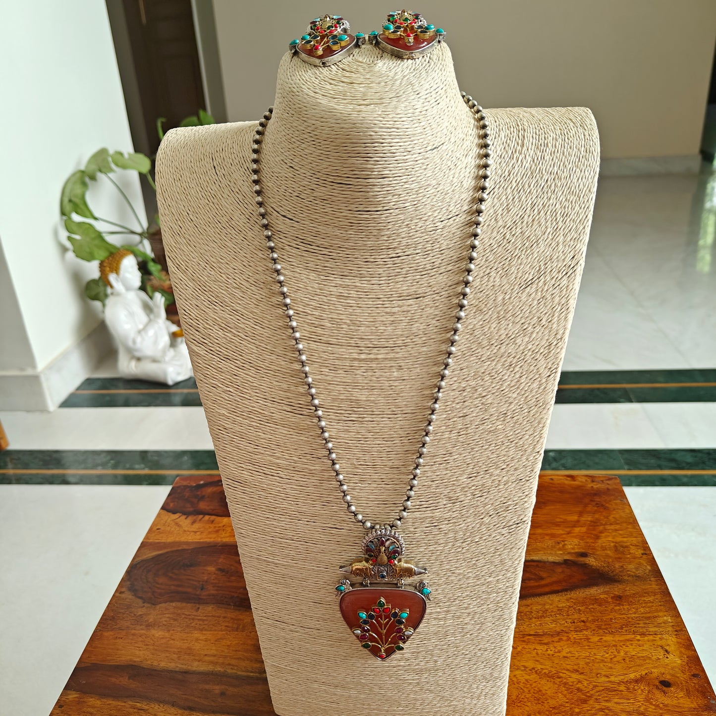 Dual tone set with triangular stone with work and stones highlights on top