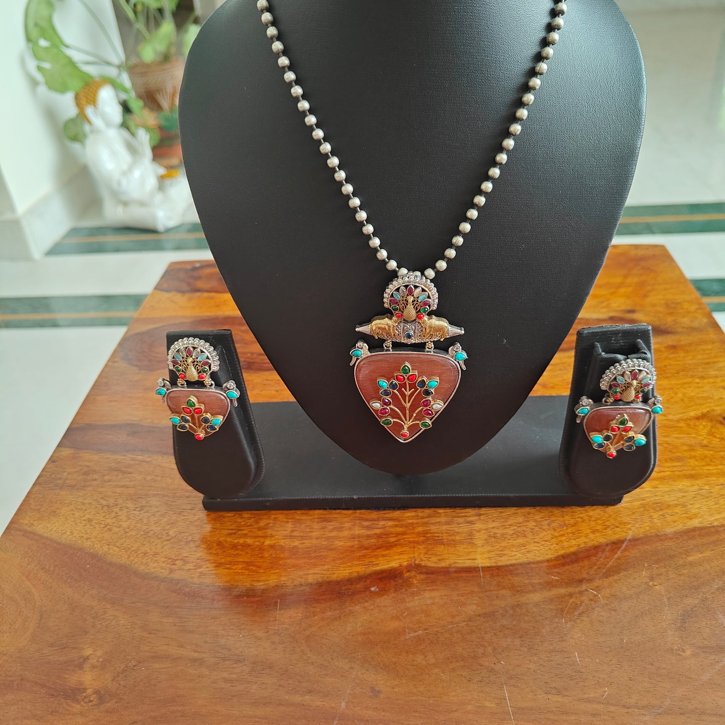 Dual tone set with triangular stone with work and stones highlights on top