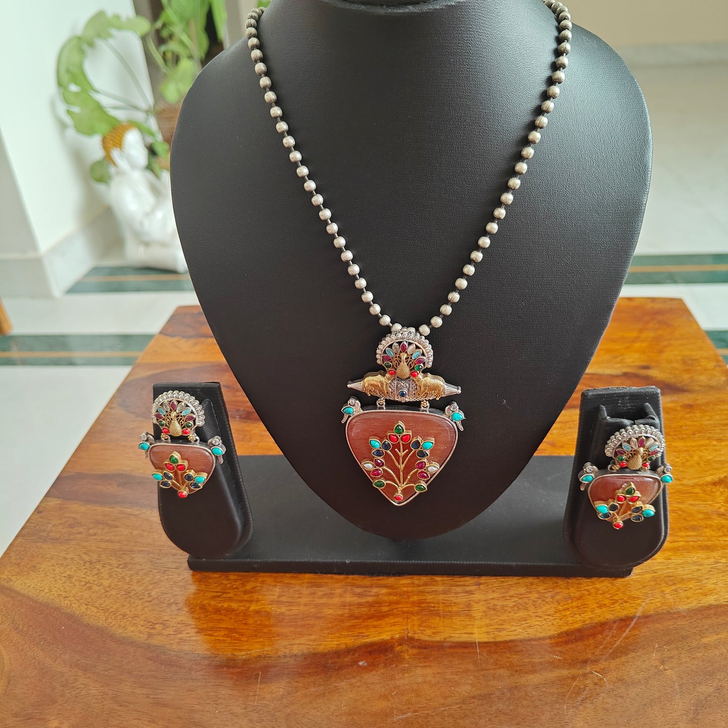 Dual tone set with triangular stone with work and stones highlights on top
