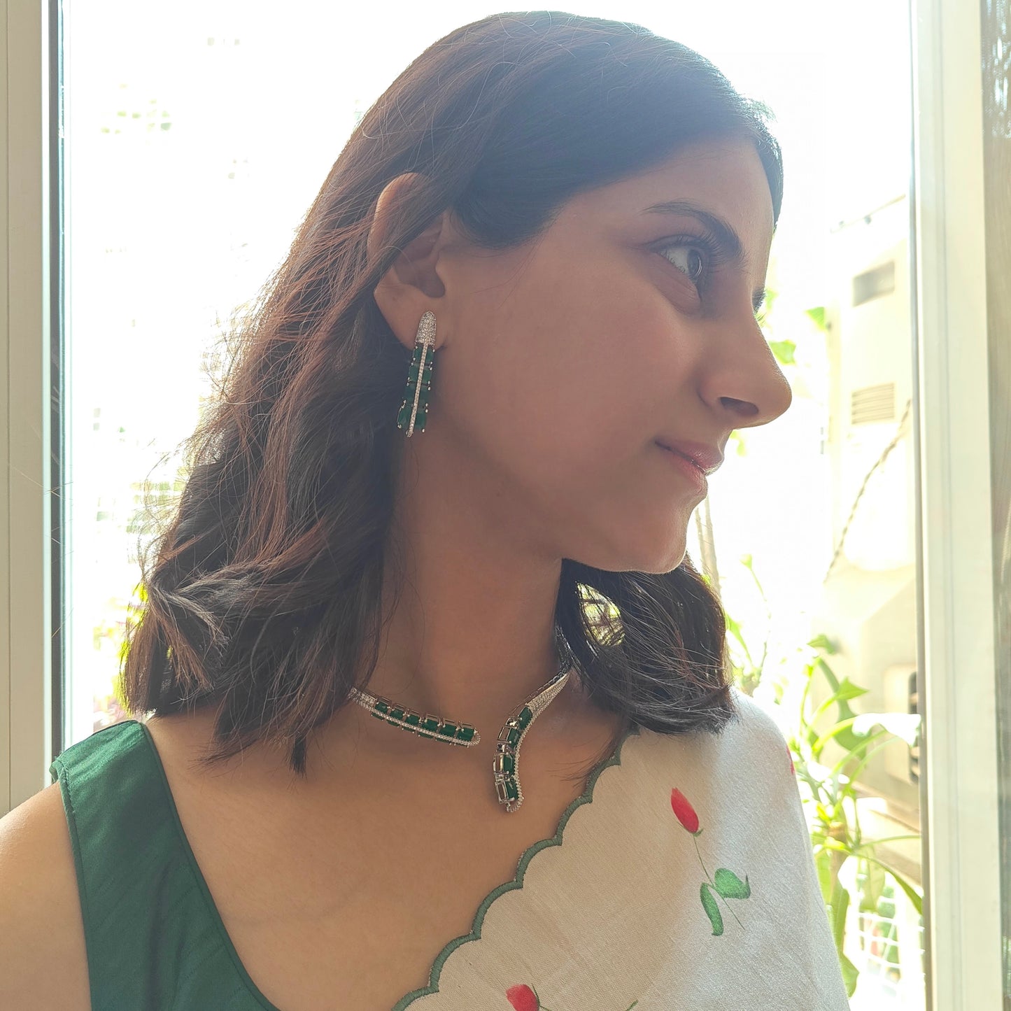 Pival set with green emeralds and Cz