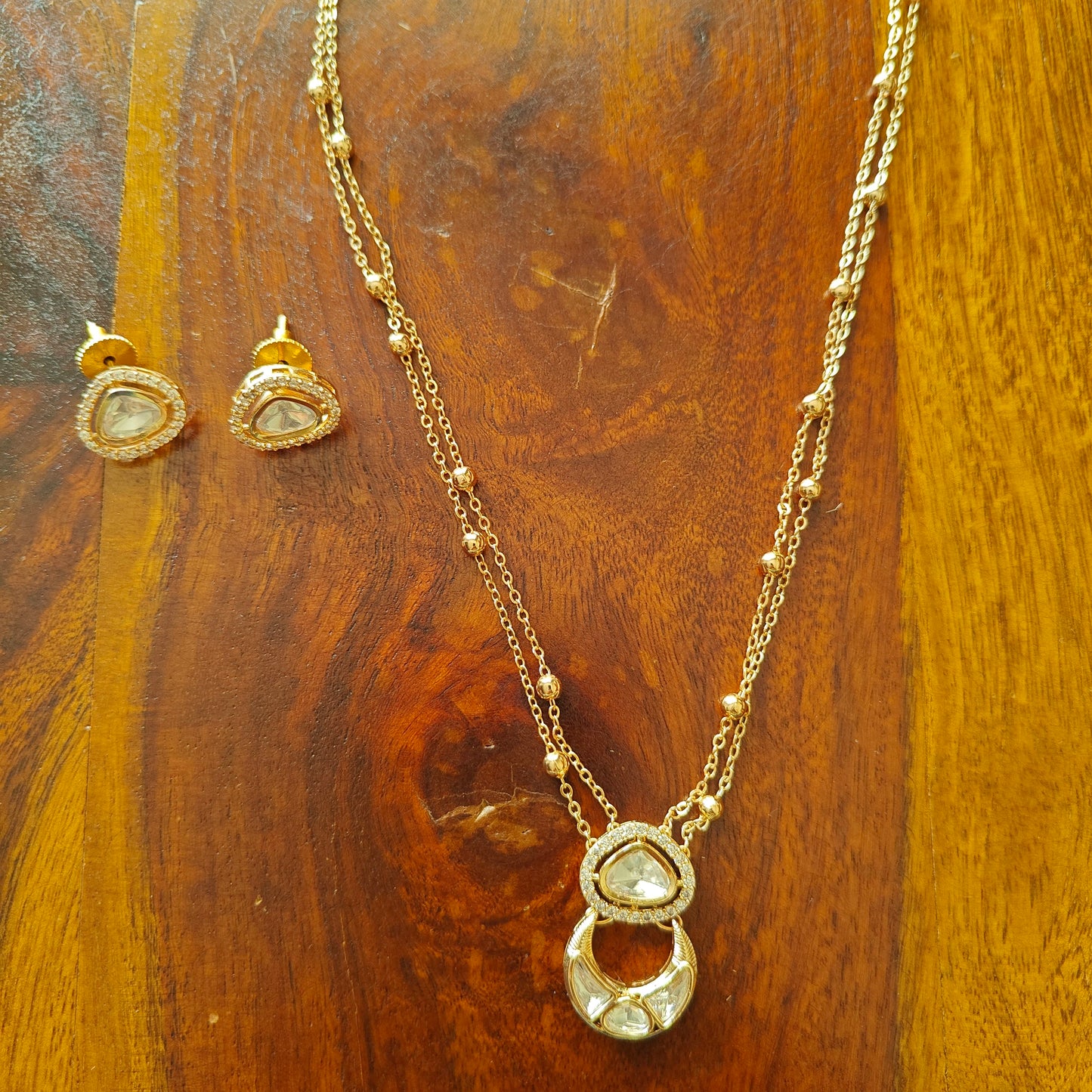 Delicate Nimisha set with suspended kundan pieces
