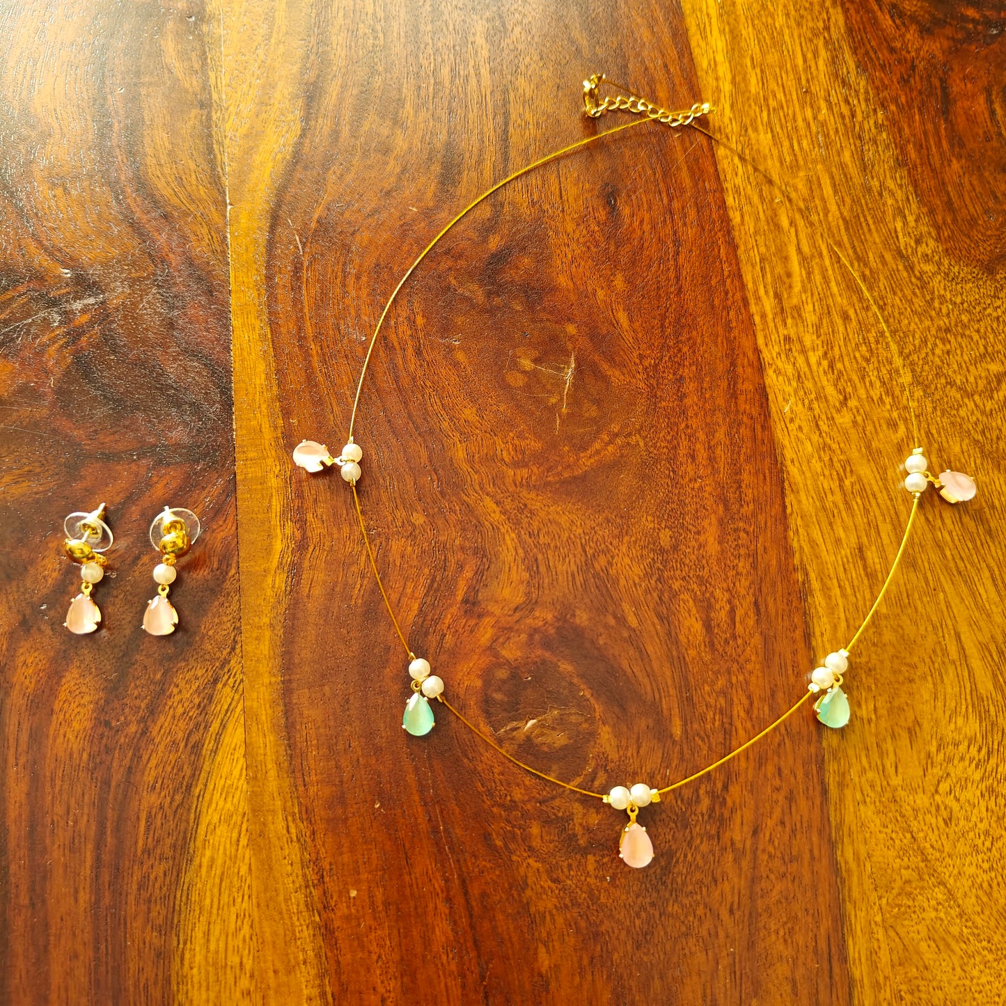 Set with stones on a stiff chain