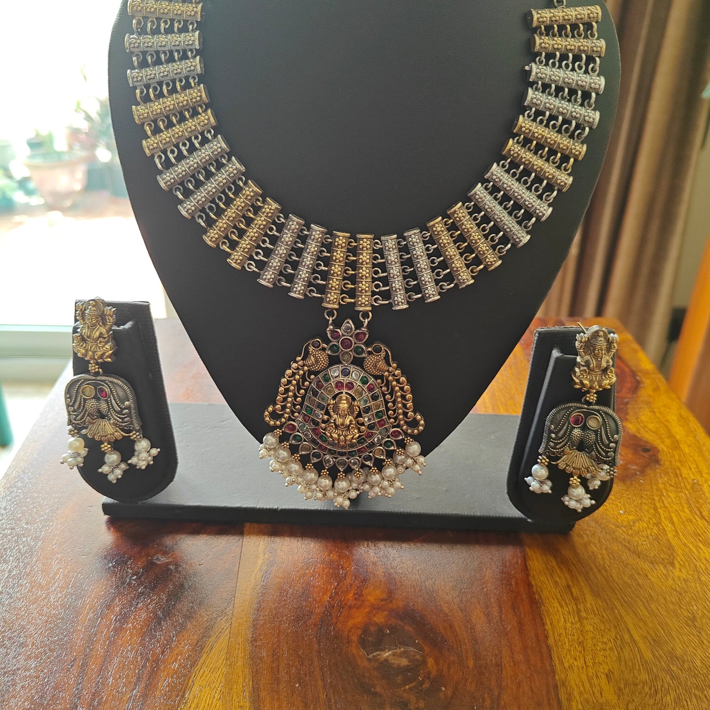 Dual tone necklace set with lakshmi pendant