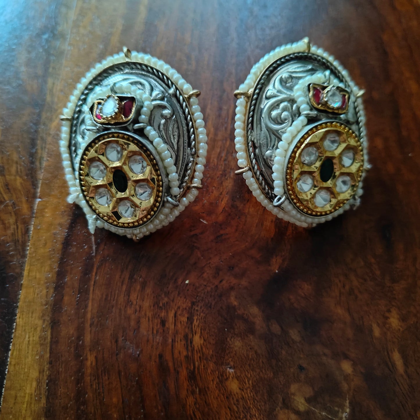 Big studs in dual tone with kundan and pearl work
