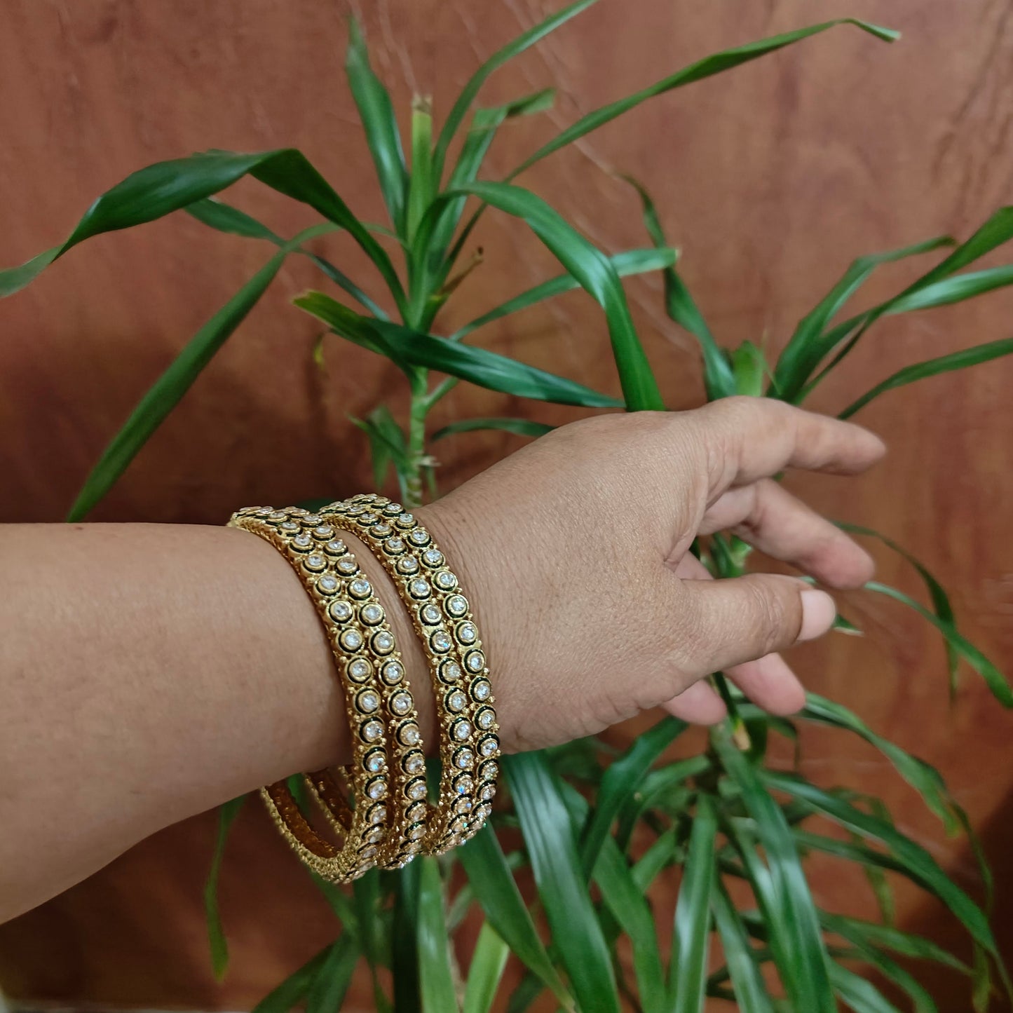 Stone bangles with green meenakari on round stones(4pc)