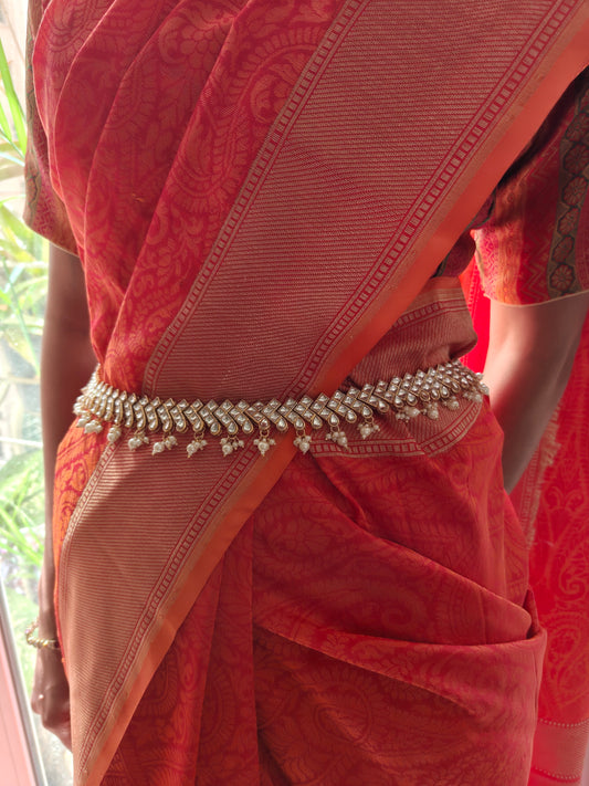 Golden broad belt with kundan pieces and pearl hangings