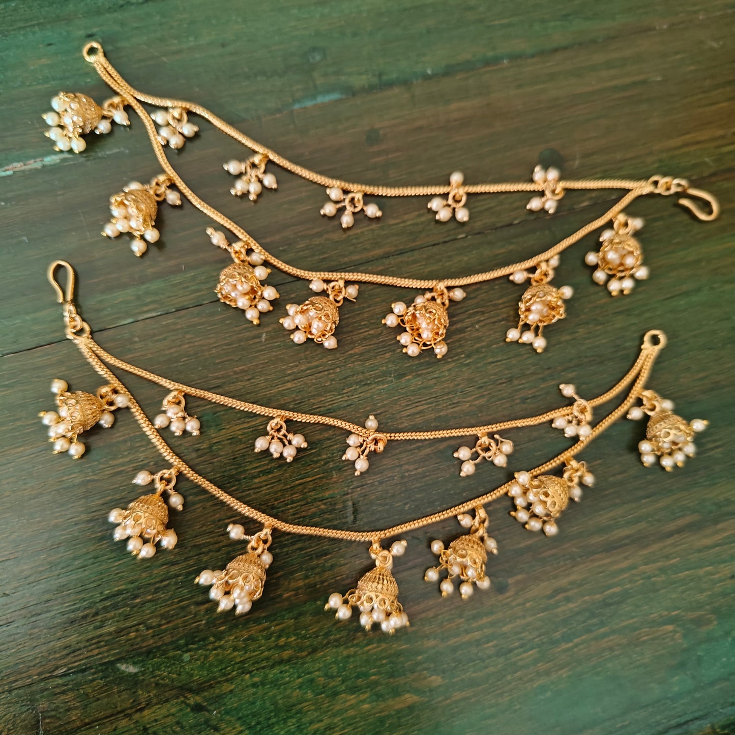 Earchains with golden jhumkis with pearls