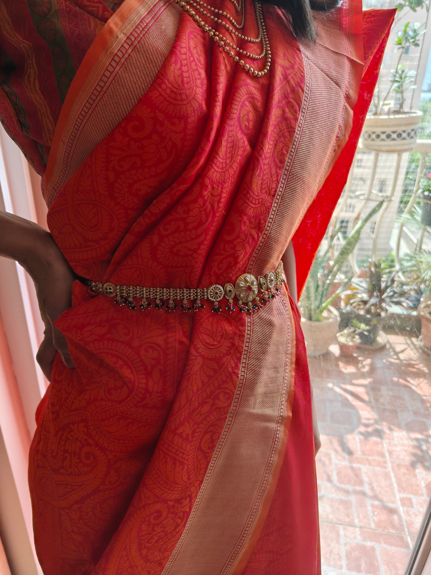 Golden belt with central round piece with kundan and stones hangings all over