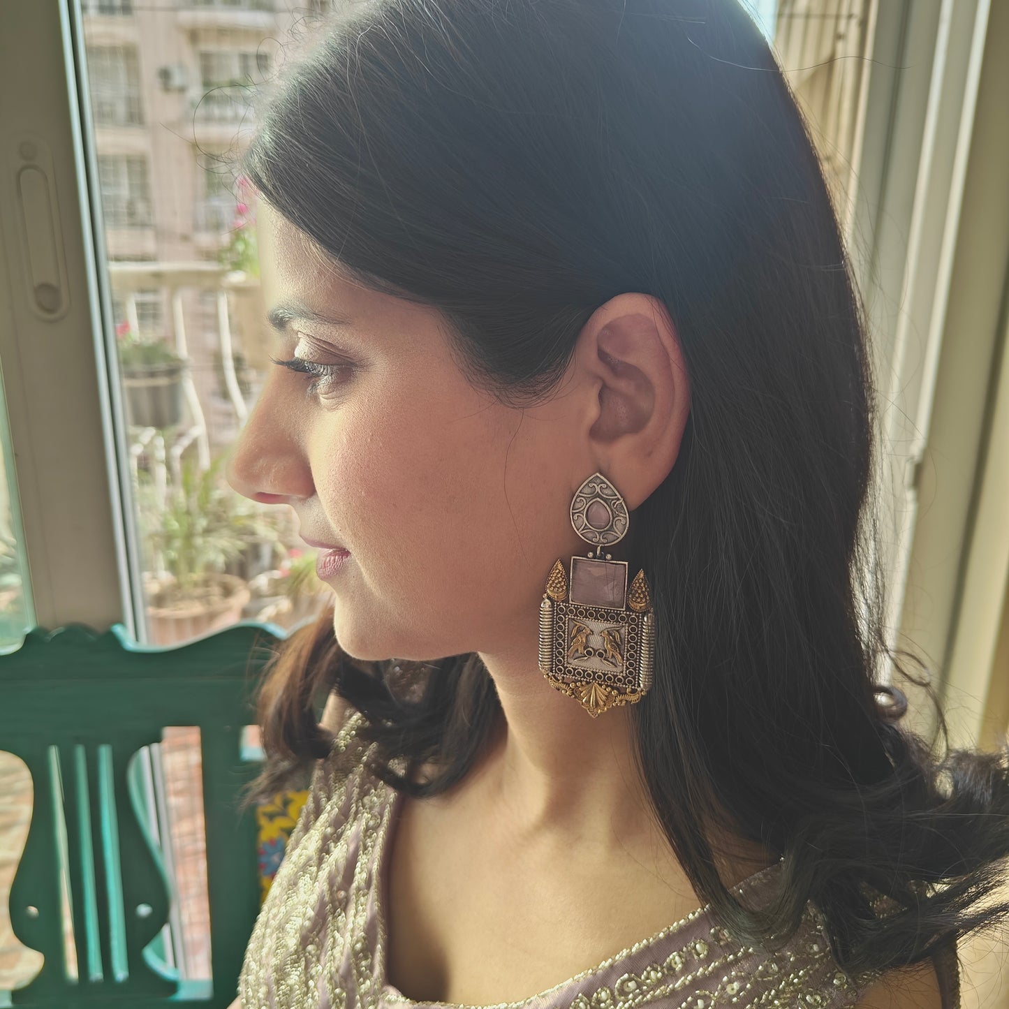Dual tone earrings with baby pink stone and birds engraved