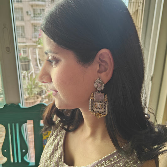 Dual tone earrings with baby pink stone and birds engraved