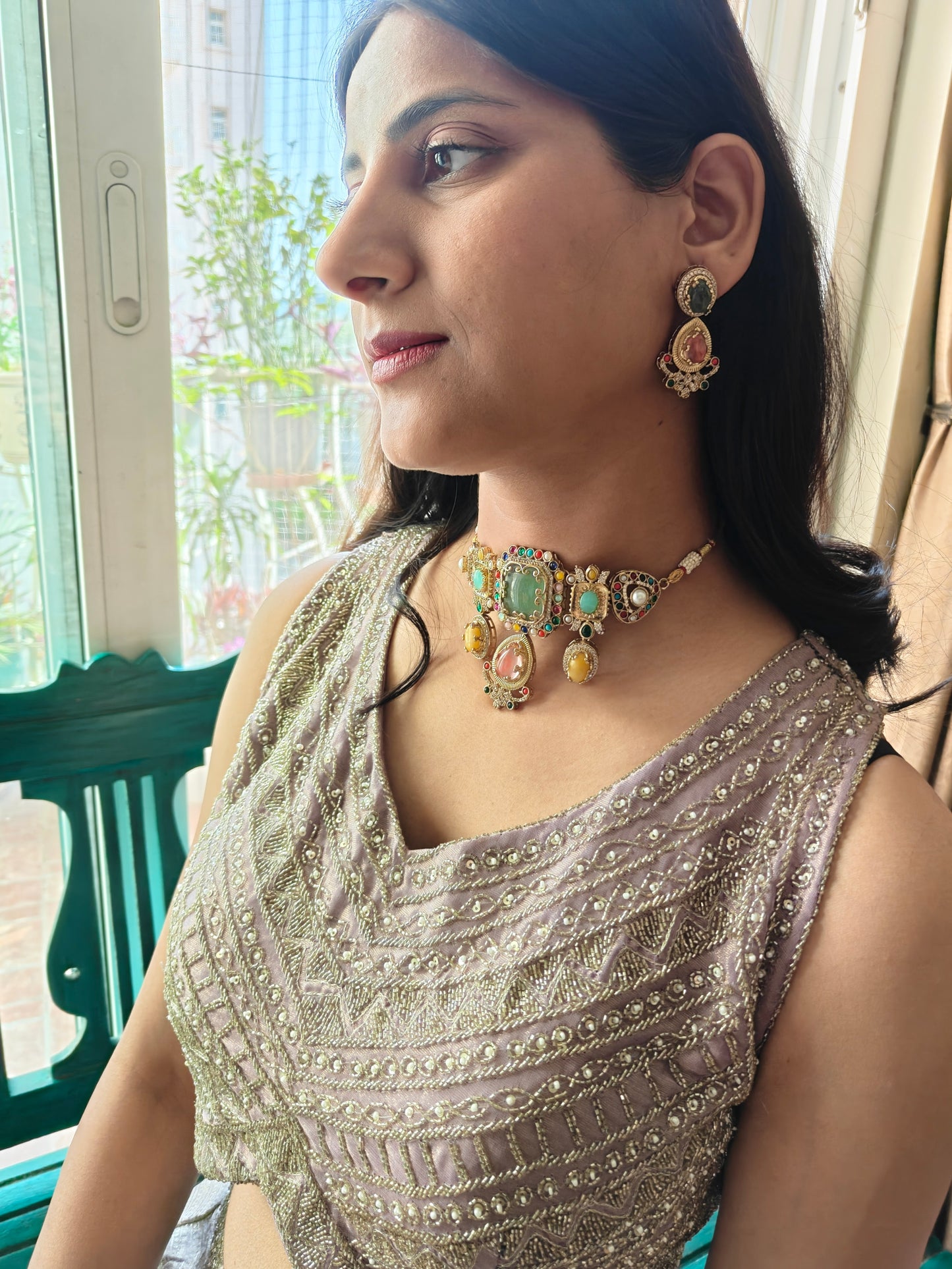 Urvi choker set with emerald green stone and Navratan stones