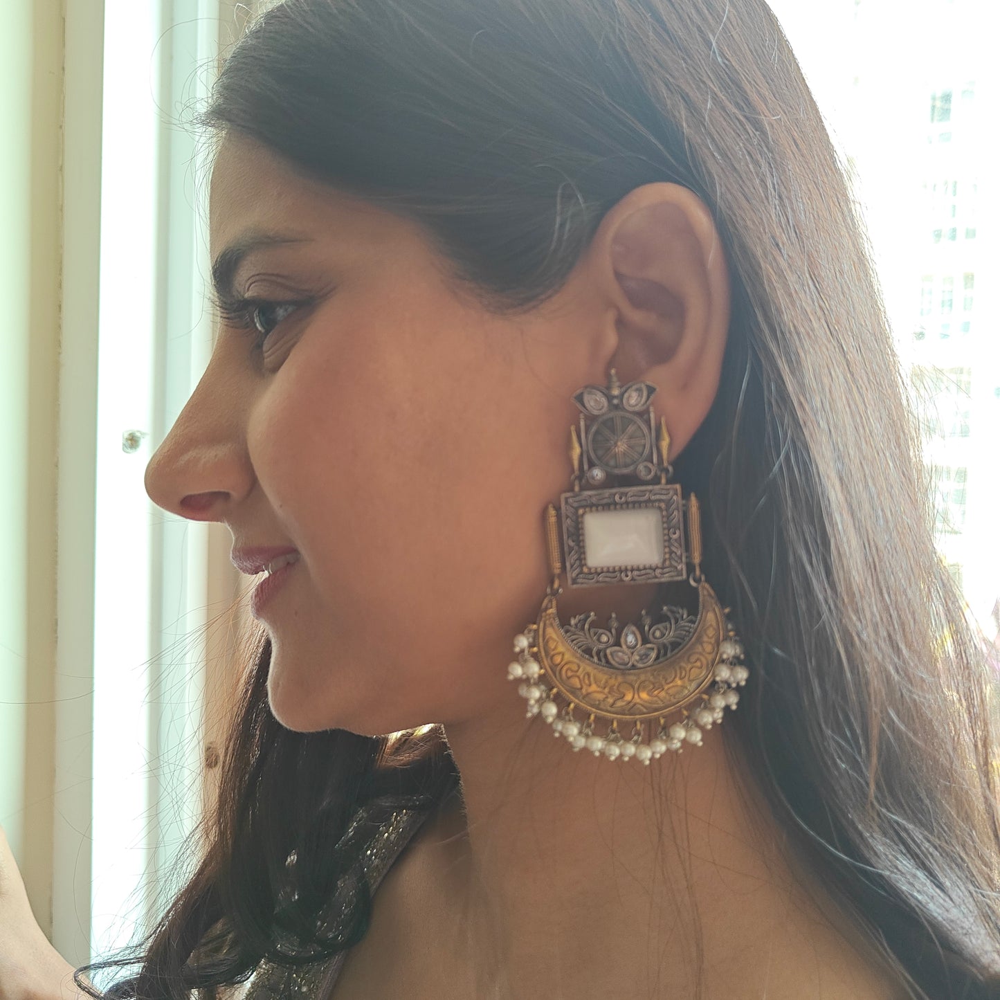 Dual tone earrings with milky white stone and crescent moon hanging