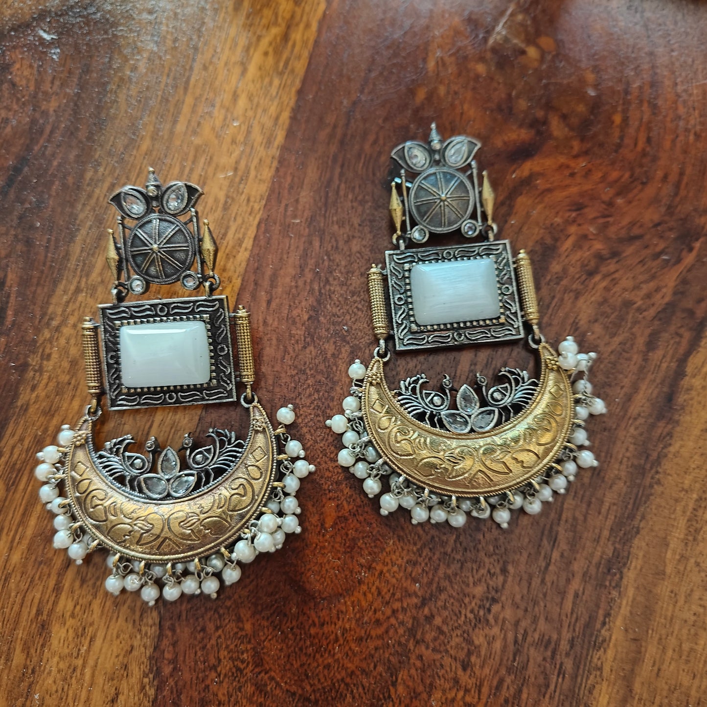 Dual tone earrings with milky white stone and crescent moon hanging